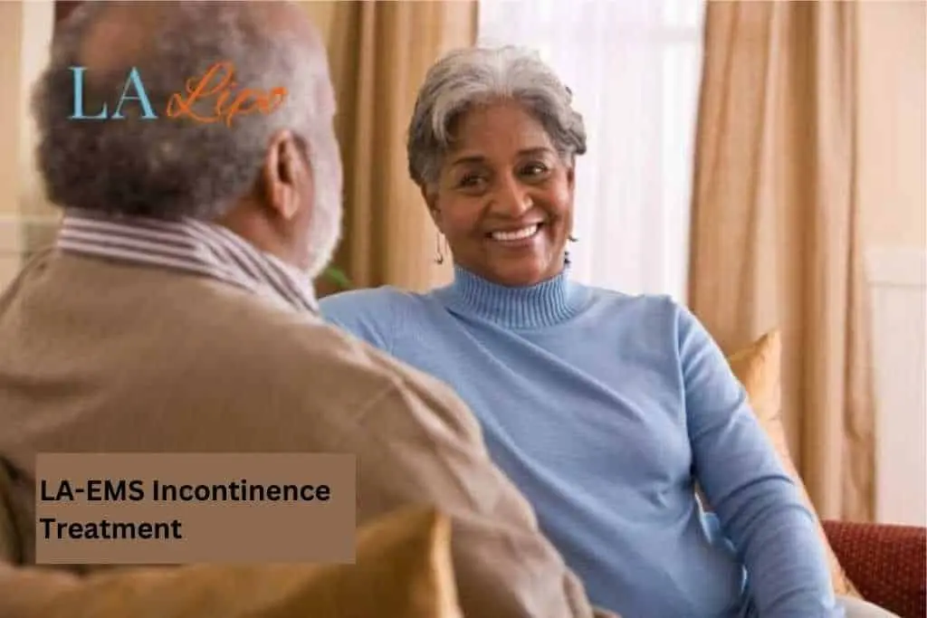 Couple sat smiling at each other - LA-EMS treatment Harpenden
