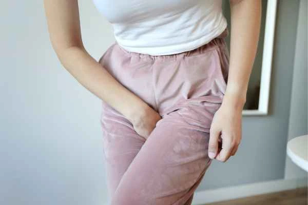 older woman running to the toilet because of urinary incontinence Harpenden