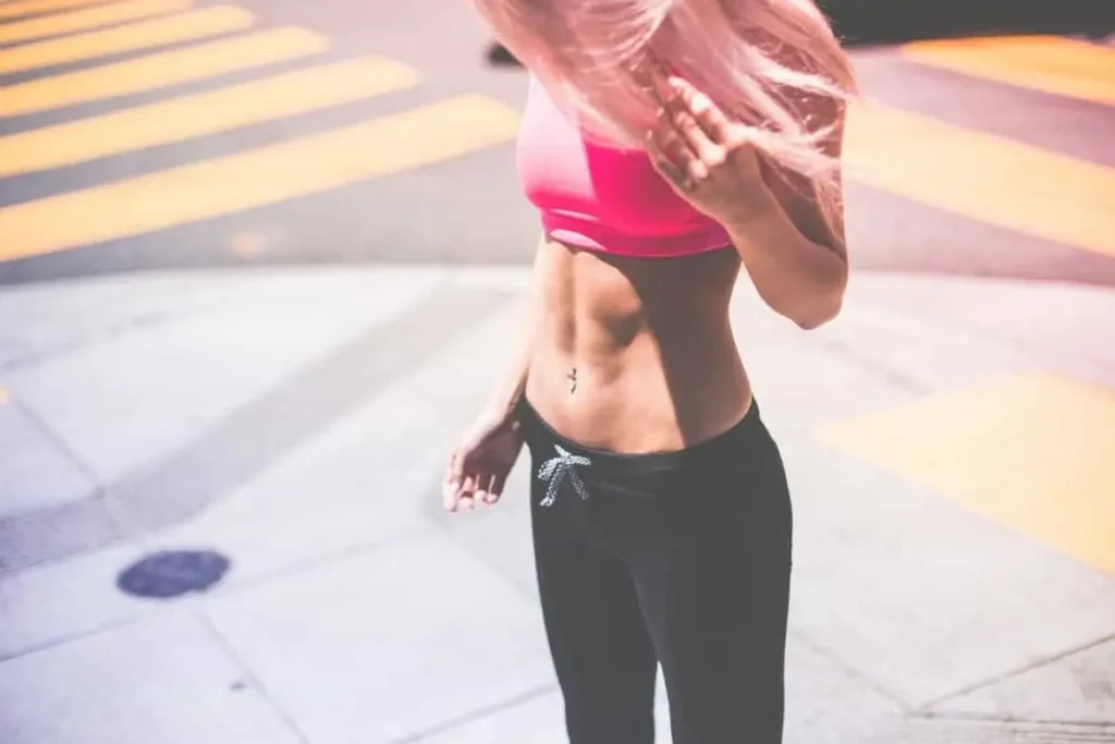 Woman with toned stomach after LA-EMS Body Sculpting Treatment Harpenden